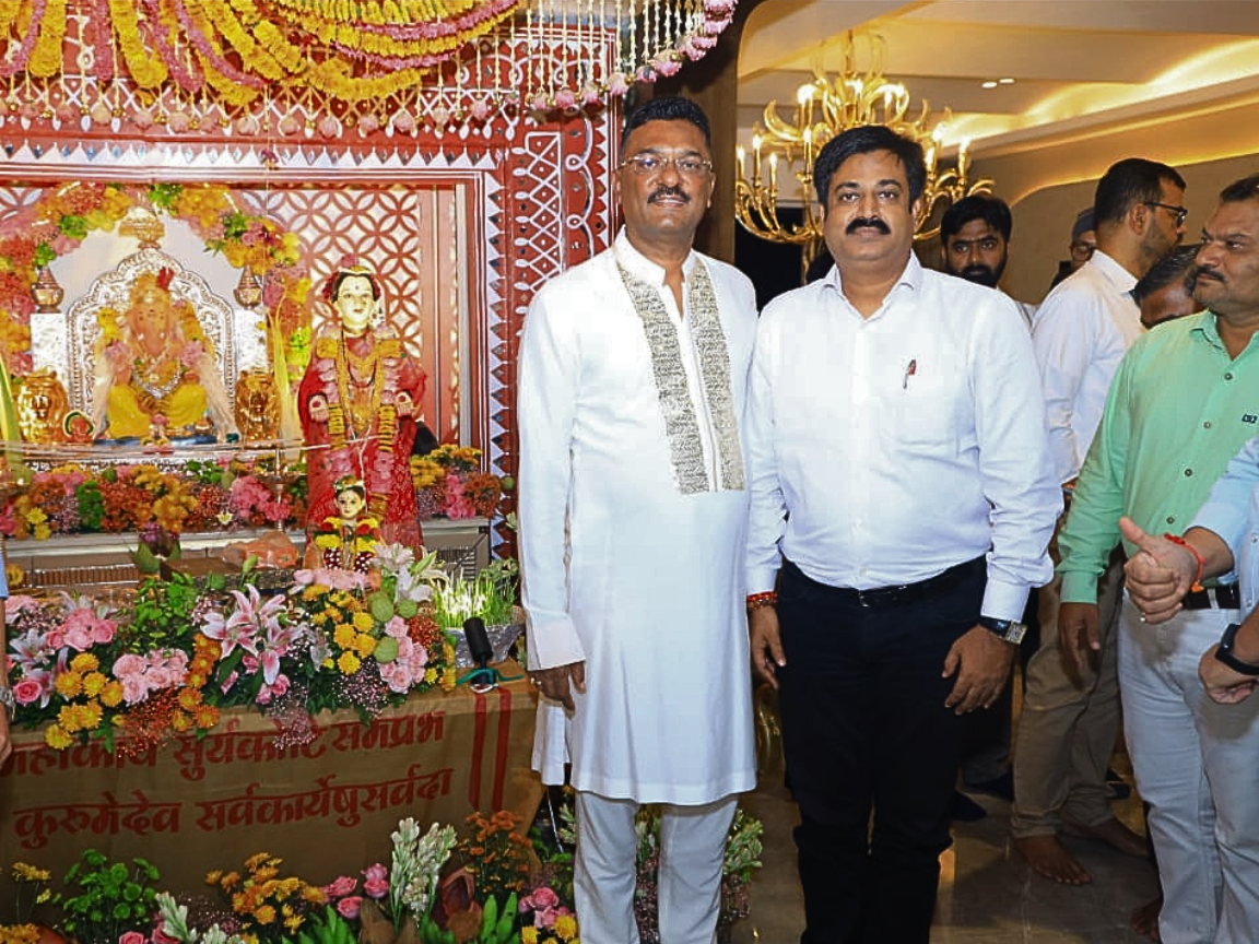 Maharashtra Transport Minister Partap Sarnaik is photographed with Sunil Keshary at his personal residence in Thane during the annual Ganesh Chaturthi festival. The two leaders are posing in front of the family's elaborate and traditionally decorated Ganpati Bappa altar. This event is a traditional stop for many political and social dignitaries during the Ganeshotsav season.